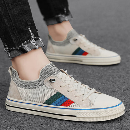 Ladies' sneakers with breathable mesh structure and trendy striped elements