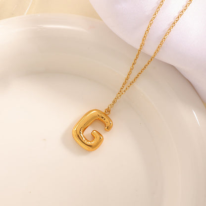 Women's necklace with curved letter pendant Tom Cottons