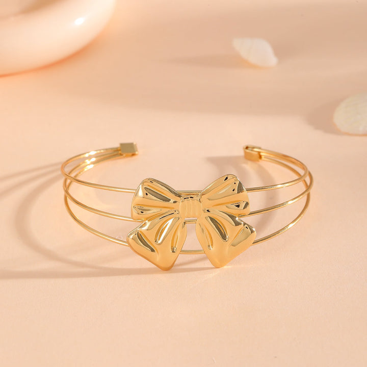 Women's bracelet with intricate bow design Tom Cottons