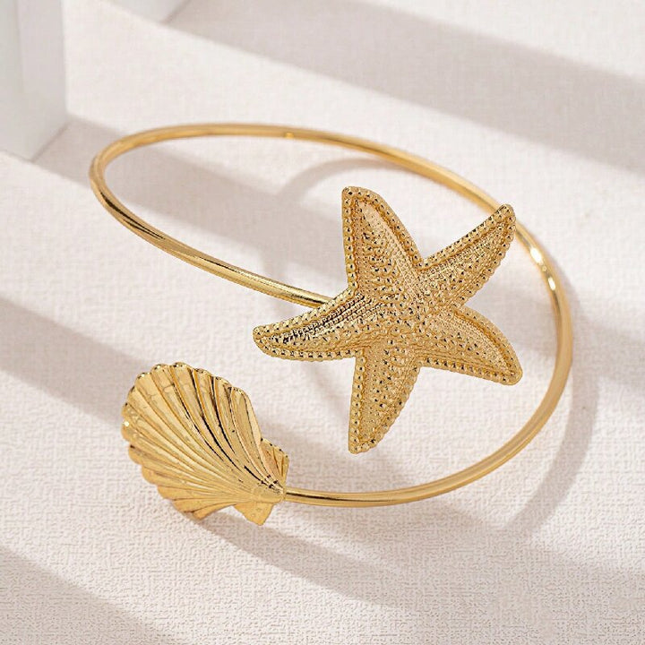 Women Open Bangle with Maritime Star and Shell Design Tom Cottons