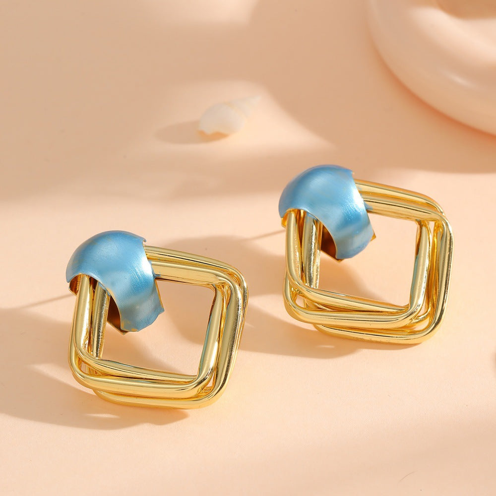 Women modern earrings with asymmetrical design Tom Cottons