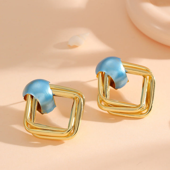 Women modern earrings with asymmetrical design Tom Cottons