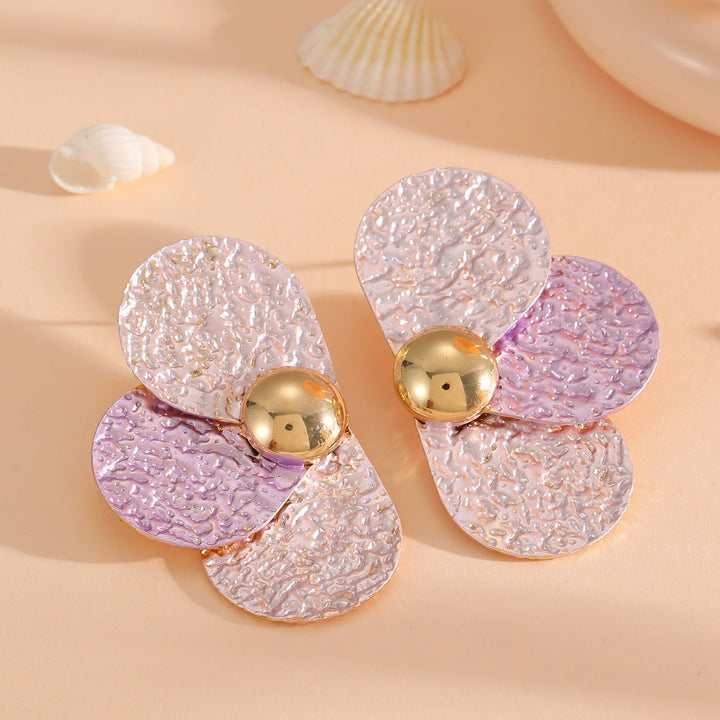 Women's ear clips in elaborate floral pattern Tom Cottons