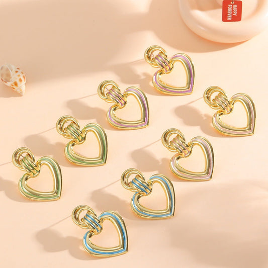 Women’s earrings in modern heart design Tom Cottons
