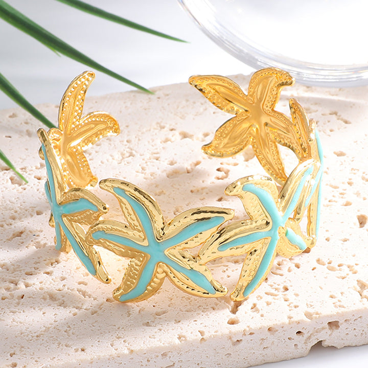 Ladies Open Cuff Bracelet with Expressive Star Motif Tom Cottons