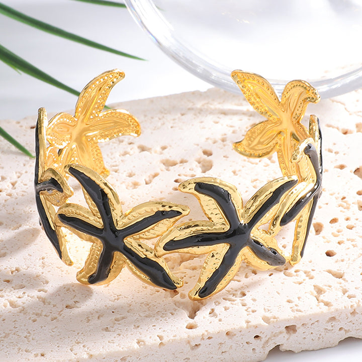 Ladies Open Cuff Bracelet with Expressive Star Motif Tom Cottons