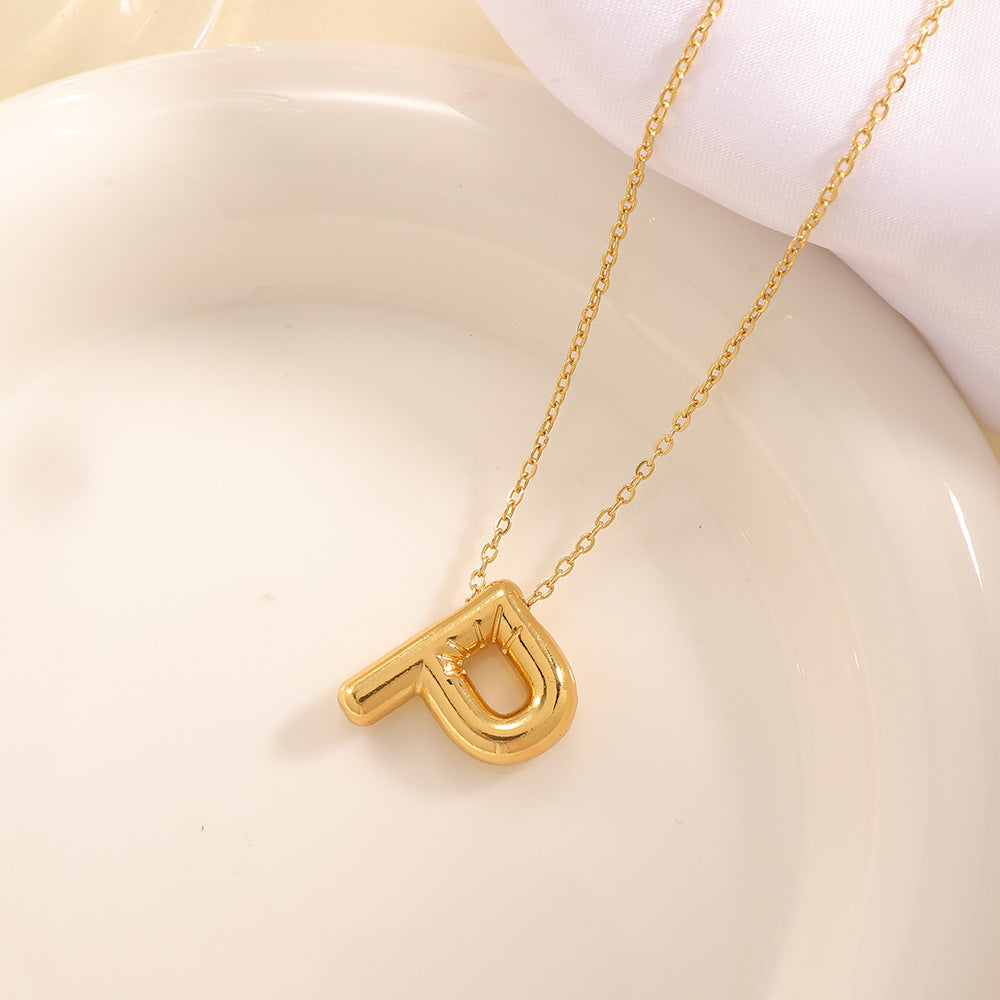 Women's necklace with curved letter pendant Tom Cottons