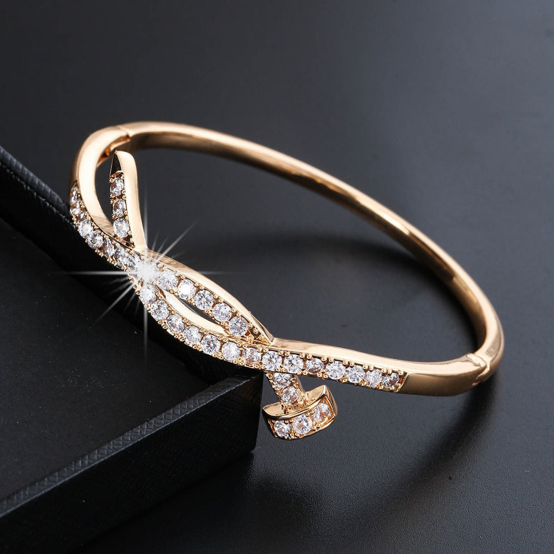 Women's bangle with elegant infinity pattern and sparkling zirconia Tom Cottons