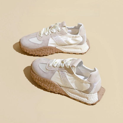 Women's sporty sneakers with sparkling accents and futuristic design