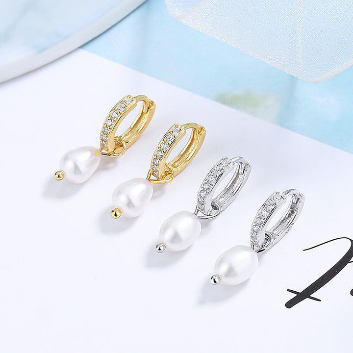 Ladies earrings with elegant zirconia decorations and pearl pendants Tom Cottons