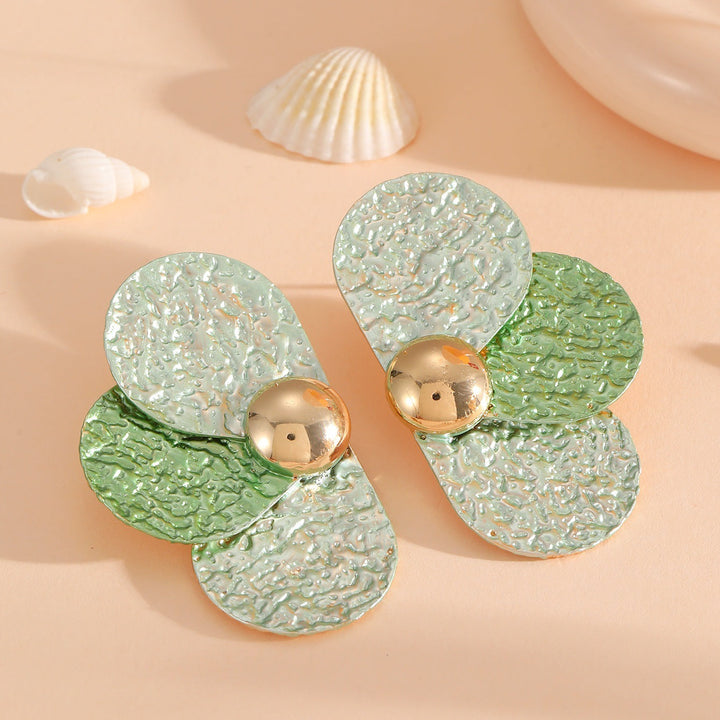 Women's ear clips in elaborate floral pattern Tom Cottons