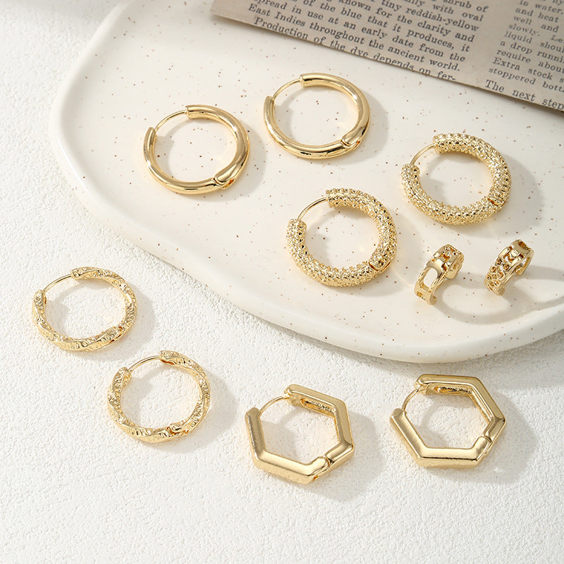 Women's hoop earrings with modern, textured design Tom Cottons