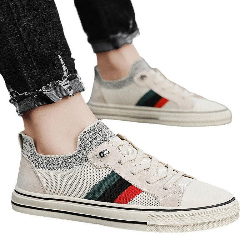 Ladies' sneakers with breathable mesh structure and trendy striped elements