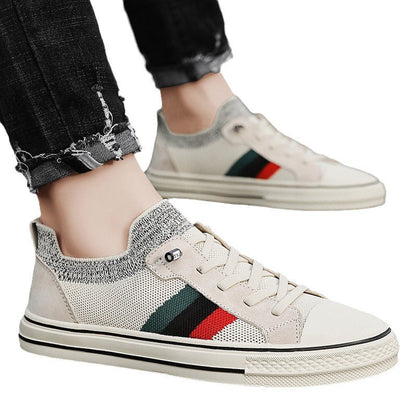 Ladies' sneakers with breathable mesh structure and trendy striped elements