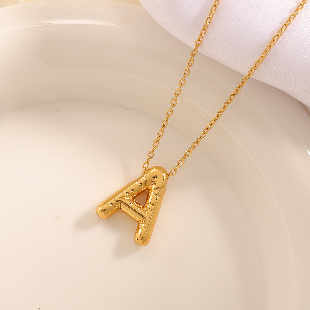 Women's necklace with curved letter pendant Tom Cottons