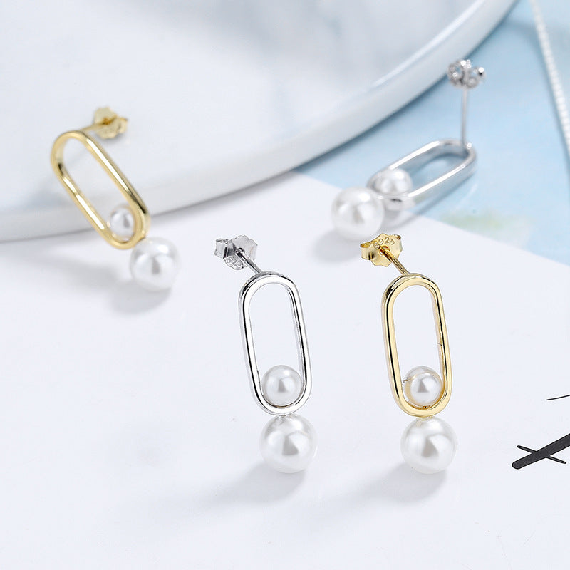 Women's stud earrings with modern oval design and elegant pearls Tom Cottons