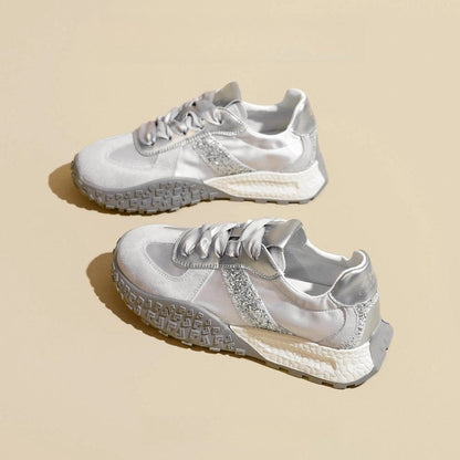 Women's sporty sneakers with sparkling accents and futuristic design