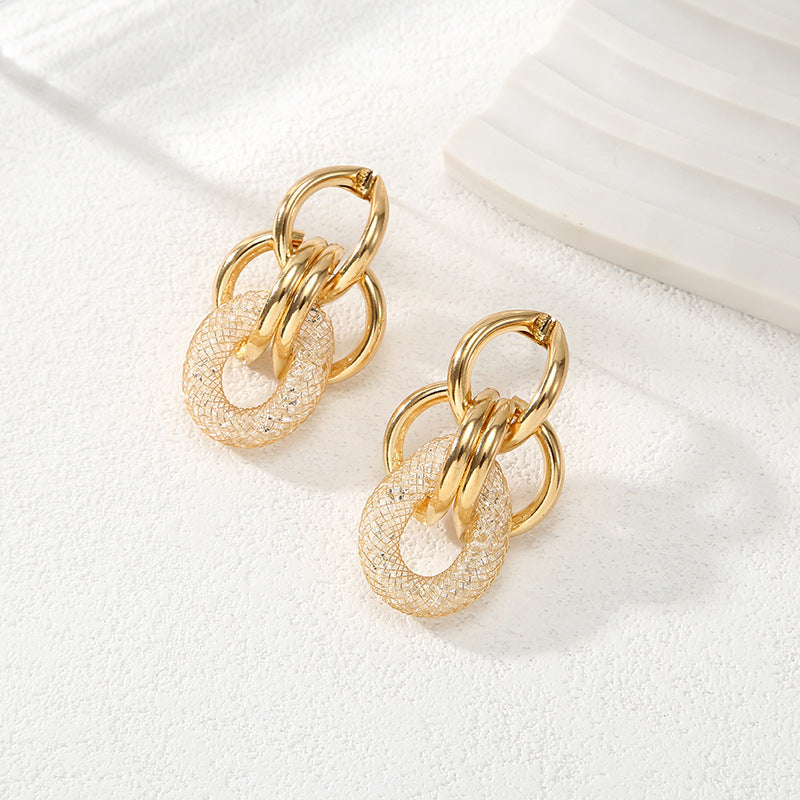 Ladies Hanging Earrings with Innovative, Gold-colored Design Tom Cottons