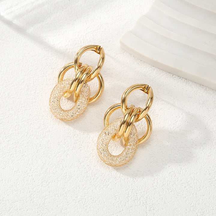 Ladies Hanging Earrings with Innovative, Gold-colored Design Tom Cottons