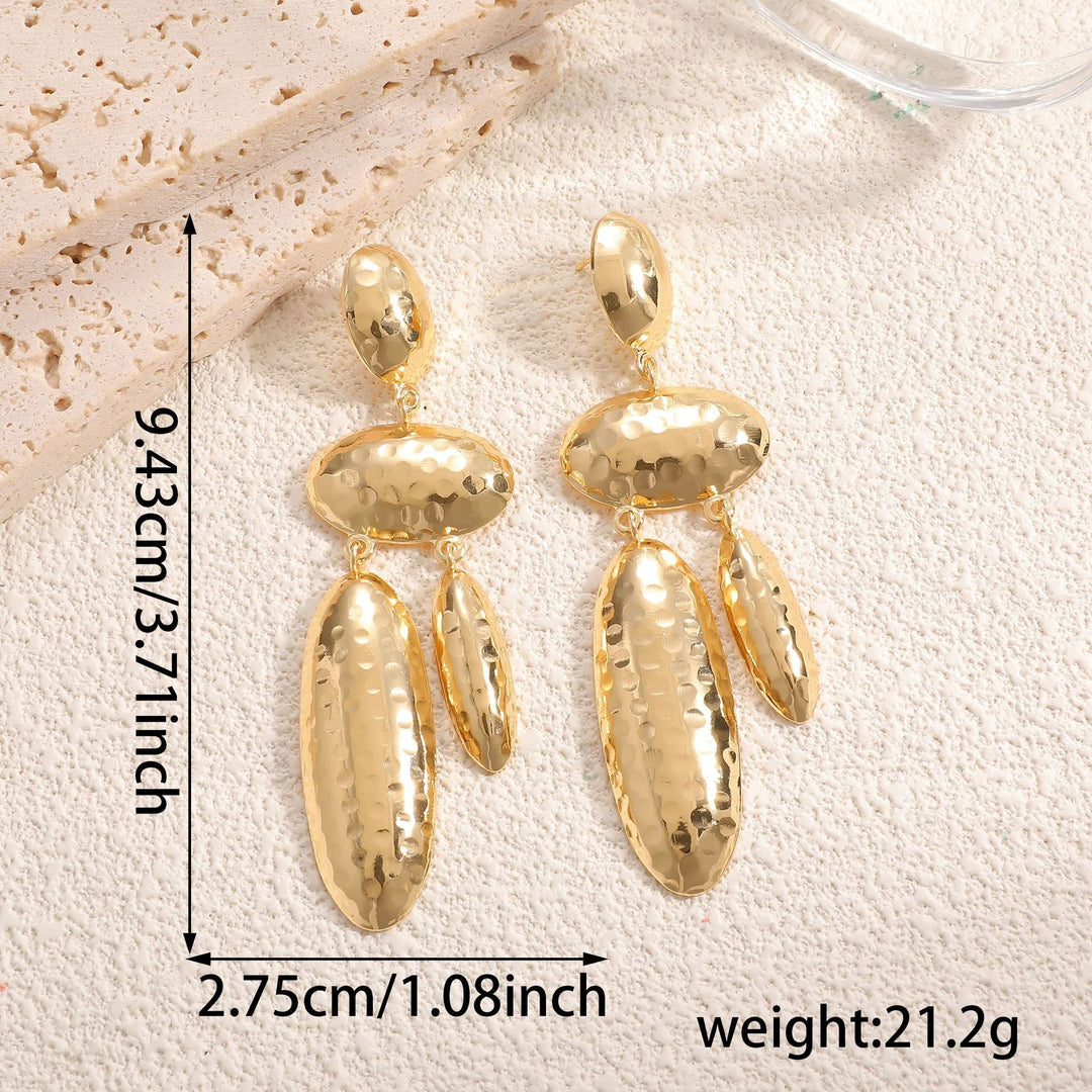 Women Hanging Earrings with artistic, three-dimensional design Tom Cottons
