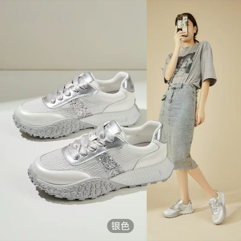 Women's sporty sneakers with sparkling accents and futuristic design